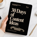 Book titled '30 Days of Content Ideas for Car Dealerships' held by a hand on a marble surface with a cup of coffee.